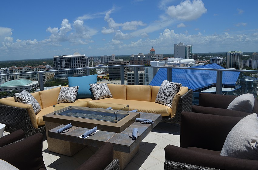 The rooftop seating areas offer a view of the city and the bay.
