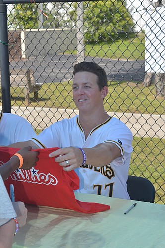 Seth McGarry signs a jersey for the Miracle League of Manasota.