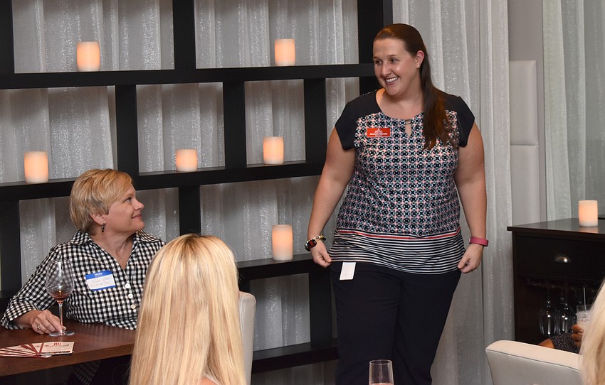 Junior League of Manatee County President Amanda Marello welcomes guests to Back to League Night August 1 at Sophie’s at Saks Fifth Avenue.