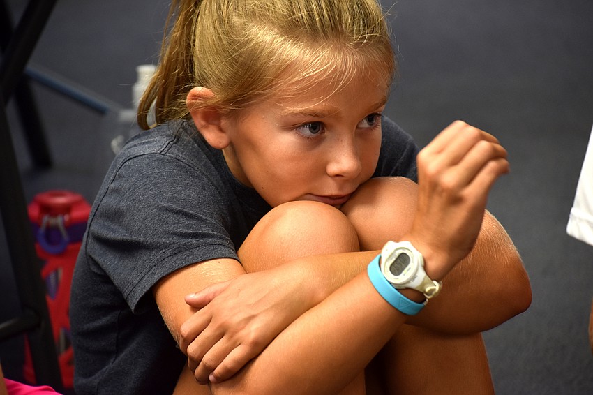 Danica Aten shows how small a turtle’s head can be.