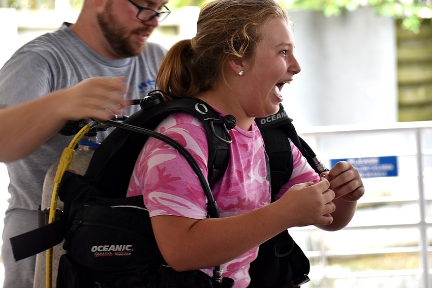 Mikayla Kelly tries on scuba gear.