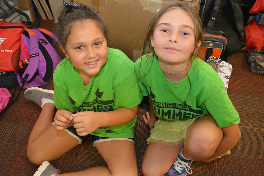 Braden River Elementary's Audri Rivera, 8, made a new friend, Chloe Elliott, at summer camp.
