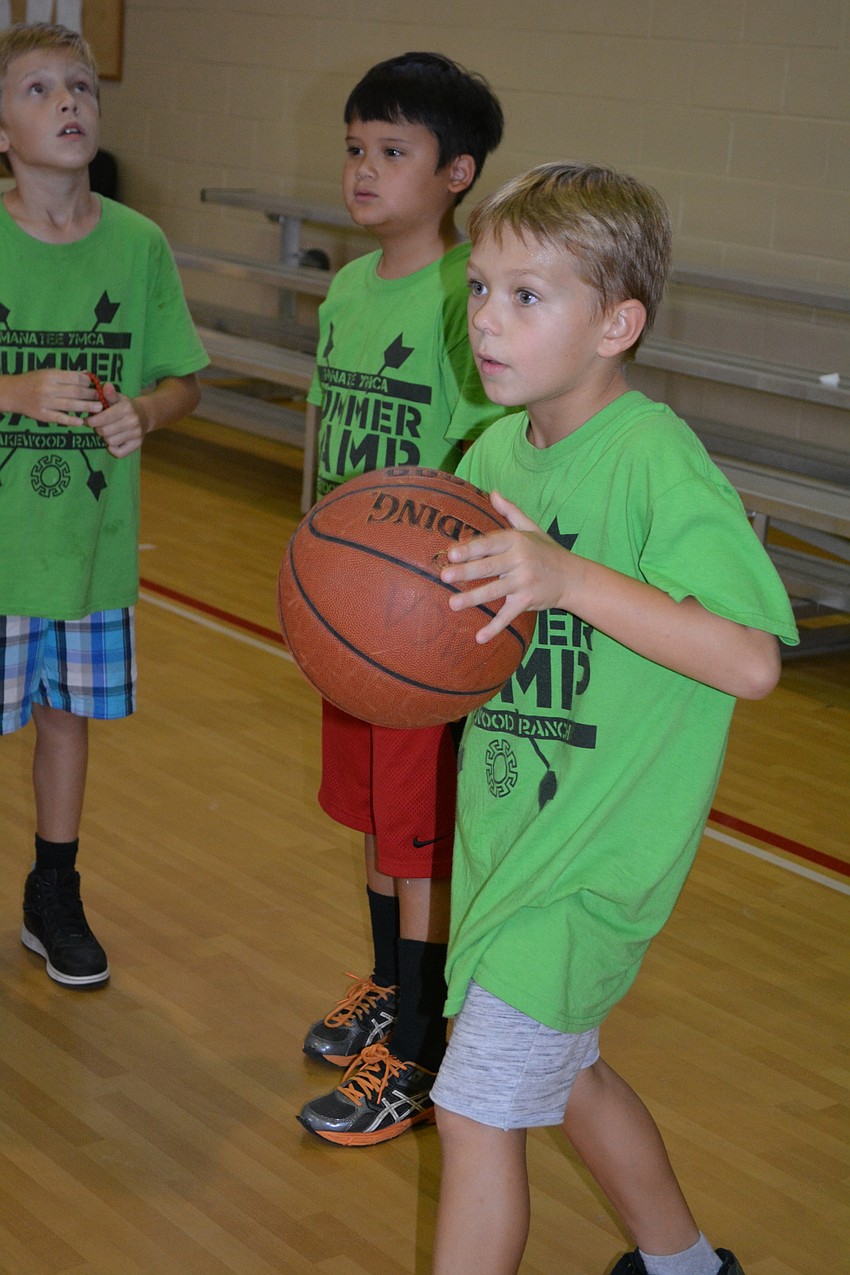 Jasper Waybright, 9, is the ball boy for the game 