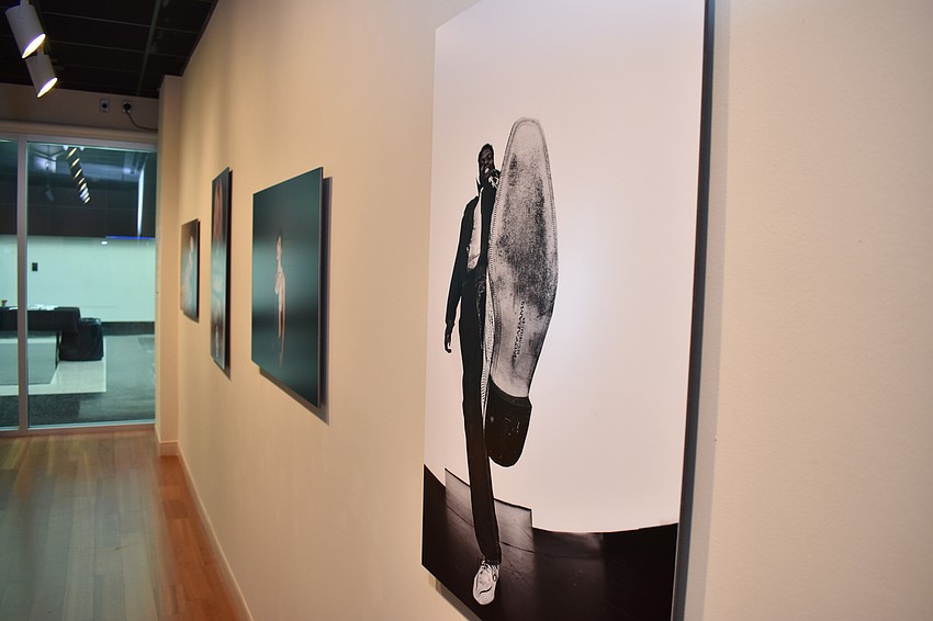 Guests admired several works such as this photo of model Steven Whitfield by Becca Buchanan at the PH_ashion 12 closing reception on August 4 at Richard and Barbara Basch Gallery.