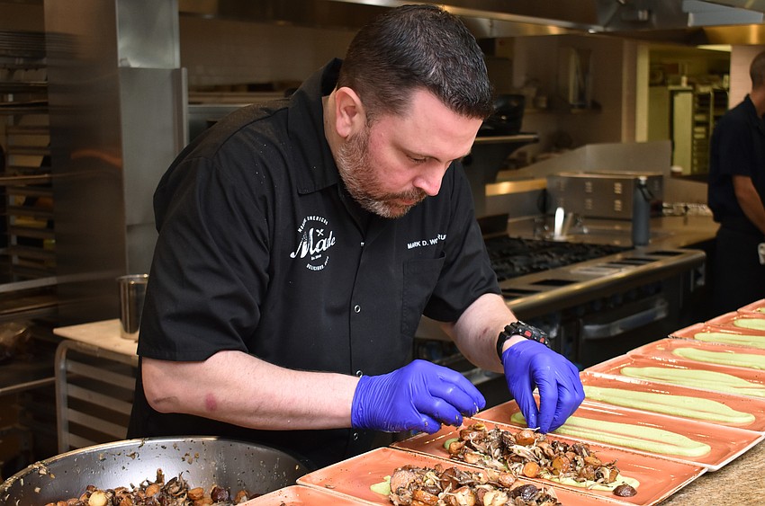 Chef Mark Woodruff of Made prepares the first course at the Fourth Annual Sustainable Seafood Dinner on Aug. 6 at Louies Modern.