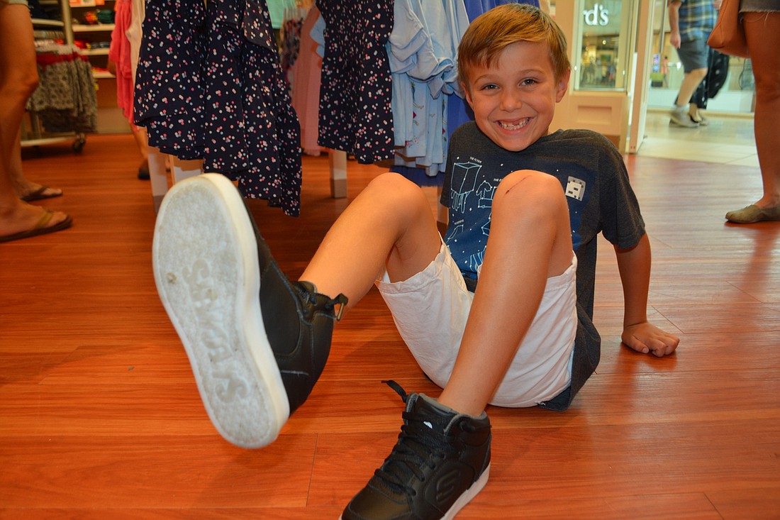 Greenbrook&#39;s Samuel Clementi shows off his Skechers Energy Lights his mom, Katie, bought him for the start of the school year at Robert Willis Elementary.