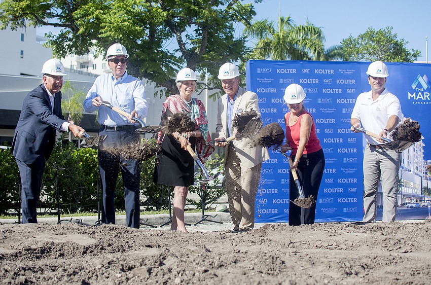 President of Kast Construction Michael Neal ceremoniously breaks ground on The Mark with Sarasota City Manager Tom Barwin,  Michael Saunders, Vice Mayor Liz Alpert and City Commissioner Hagen Brody.