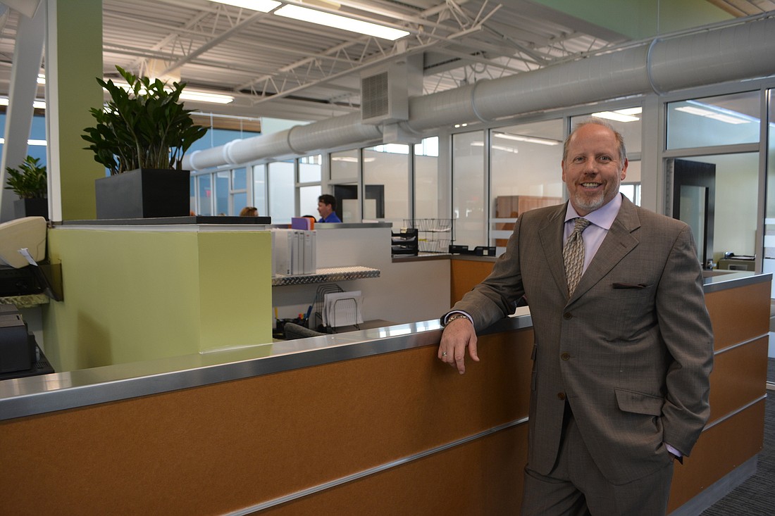 Co-owner Jeff Smith of R.E. Crawford Construction stands in his new building, which earned an Aurora Award.