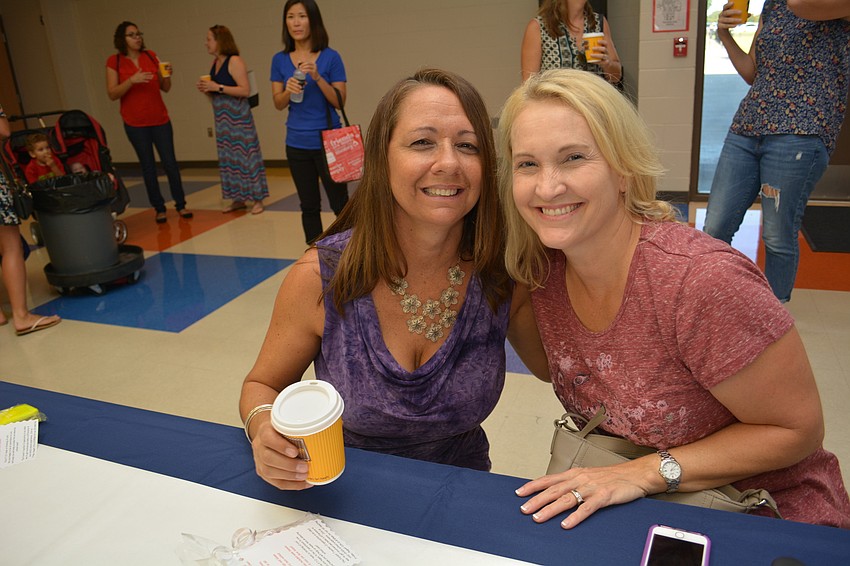 Iris Boccarossa and Christine Shaklik chat over drinks during the Boo Hoo or Yahoo Breakfast. Boccarossa's youngest child started fifth grade. It is her 10th year at Willis as a parent.
