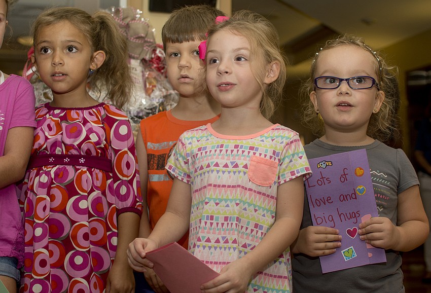 Children from the Pine's onsite preschool performed for residents during the program.