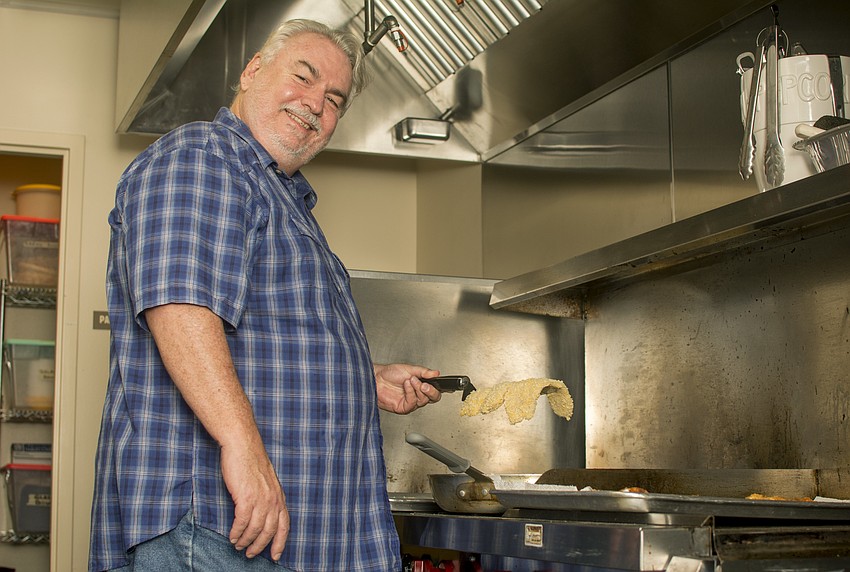 Mark Hueer fries fish for Christ Church's Fish Fry.