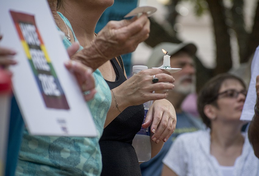 Demonstrators lit candles in honor of those injured and killed after counter demonstrators clashed with white supremacists in Charlottesville, VA on Aug. 12.