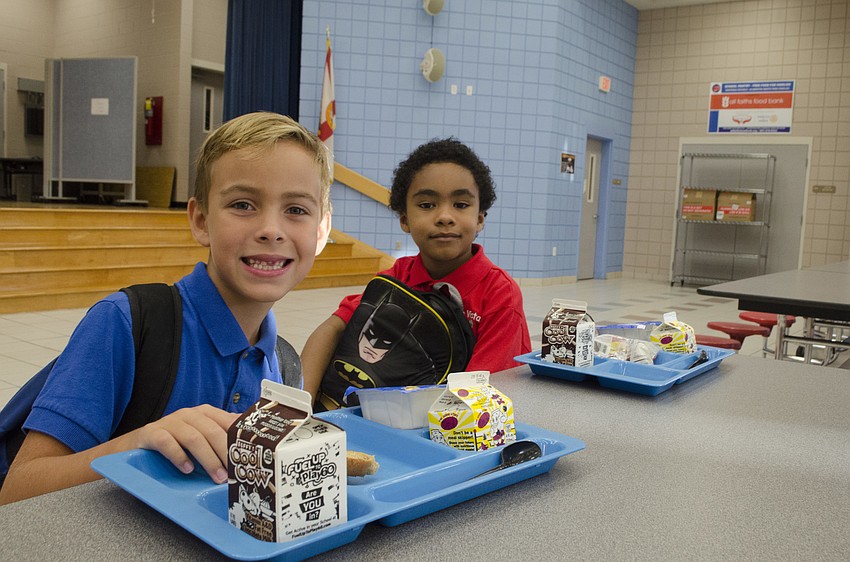 Michael Sell and Mario Esquiveo eat breakfast before their first day of second grade at Alta Vista Elementary.