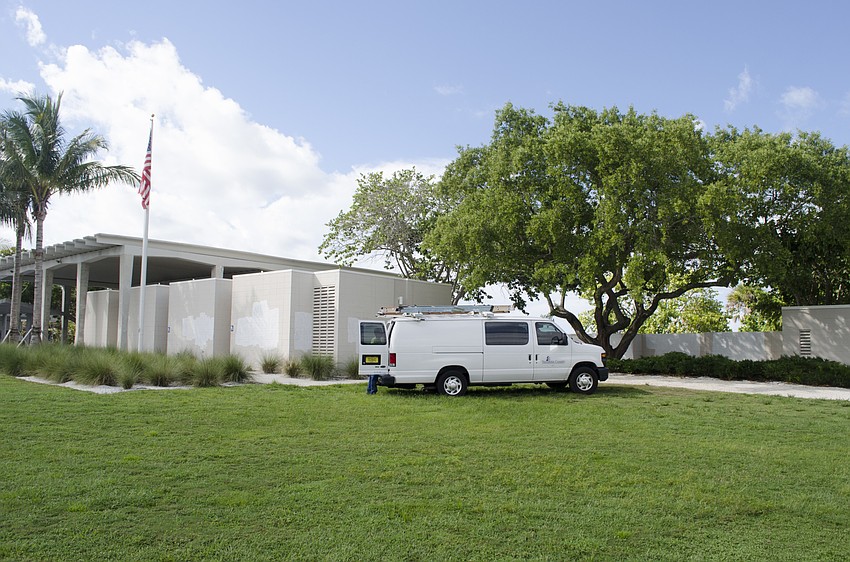 Several county workers had covered up the graffiti with white paint by 10 a.m. on Monday, Aug. 14.