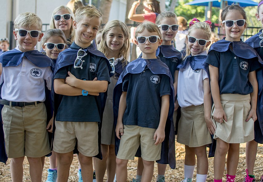ODA students pose before the solar project celebration and marine science lab ribbon cutting.