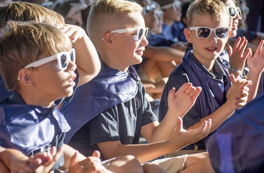 Alex Berndt, Isiaih Prete and Hayne Falck applaud ODA's newest staff members during the celebration.