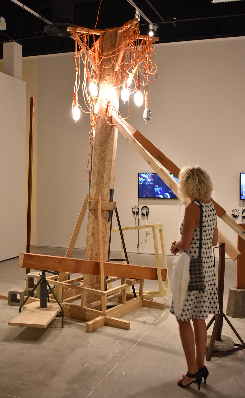 Guests viewed pieces such as Robert Aiosa’s “City, Beautiful,”meant to evoke Florida landscaping and construction imagery, on Aug. 17 at The John and Mable Ringling Museum of Art.