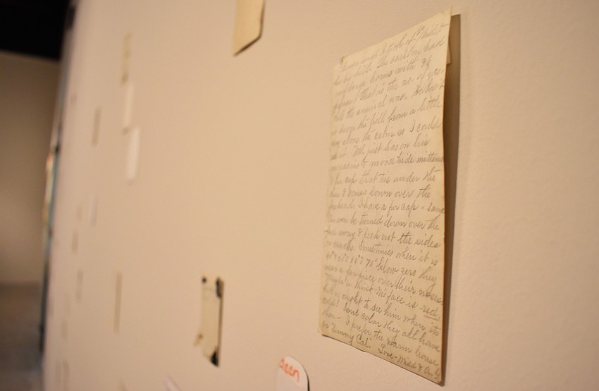 Jason Lazarus’ “Recordings #5 (Isabel),” which is a series of photos collected from thrift stores that were installed face down, was one of several works that guests viewed at the Circle Member Preview on Aug. 17 at The Ringling.