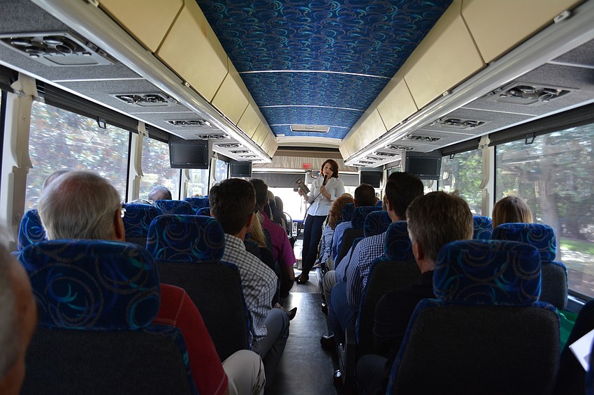 Monaca Onstad, director of community relations for Lakewood Ranch Schroeder-Manatee Ranch, leads conversation as the group heads south on the new section of Lorraine Road toward the future Waterside Place.