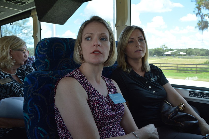 Bethany Carr, fo Kerkering Barberio, and Elizabeth Stephen, of Allegiant Private Advisors, check out the new Homes by Towne community in the future Waterside at Lakewood Ranch project.