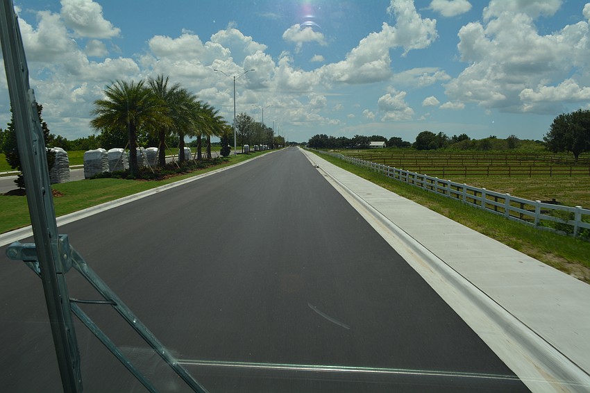 Tour-goers were the first to drive the southward extension of Lorraine Road, which will not open to the public until Sept. 6.