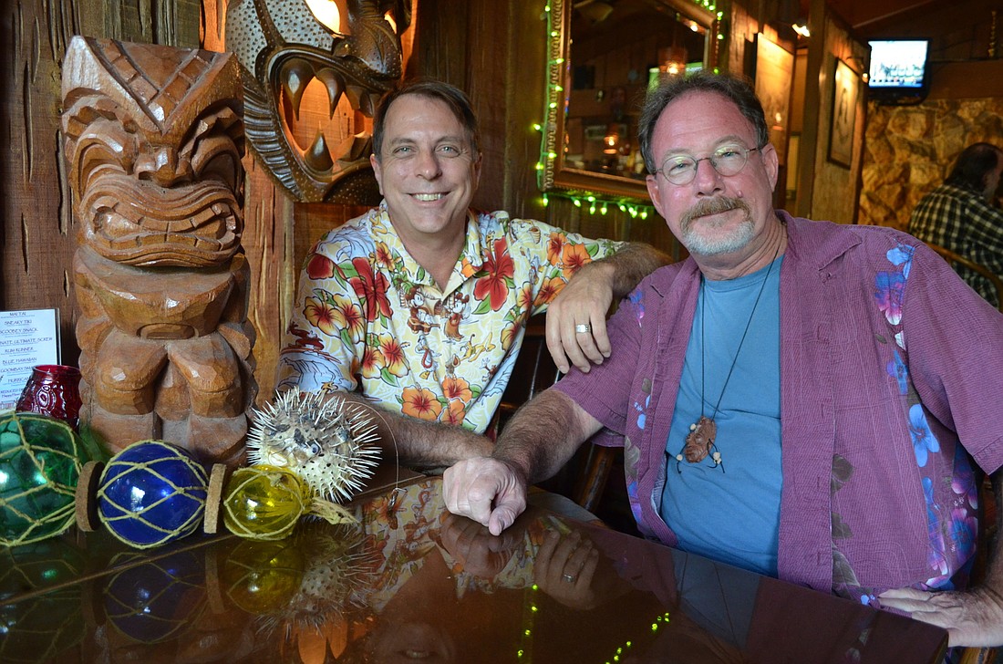 Bill Dillard (left) is a longtime Bahi Hut customer and tiki enthusiast. Scott Spear hopes to preserve the history of the Bahi Hut, one of just two authentic tiki bars that remain in Florida.