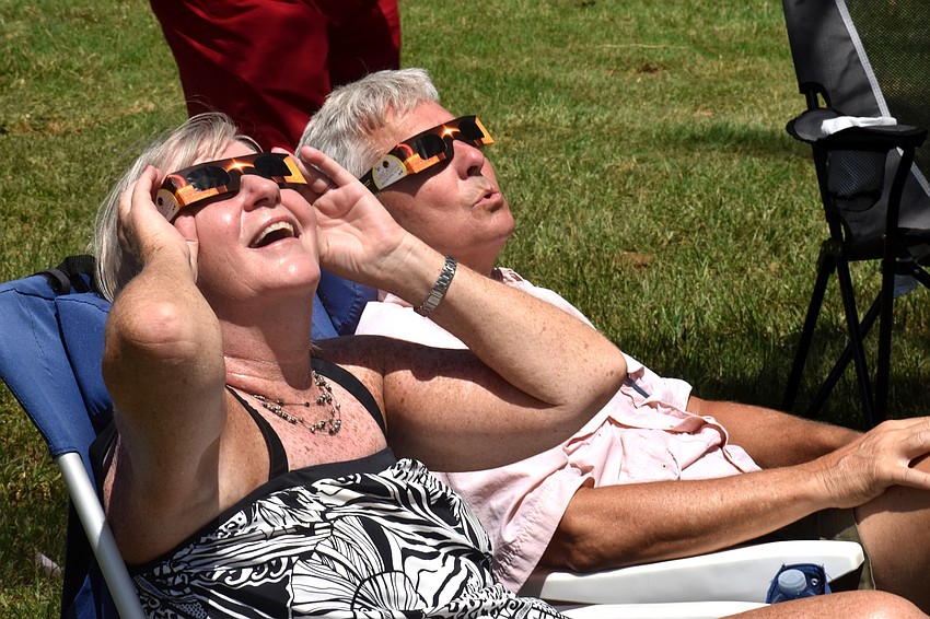 Carol and Bob Erker gaze up at the solar eclipse.