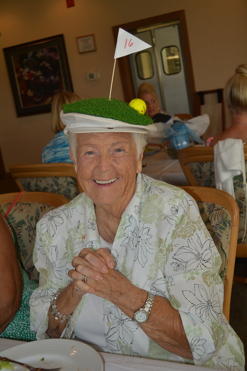 Eighty-six year old Sally Cook wore a hat her children made for her husband, Art, 36 years ago. It's Hole 16 of Peridia's golf course because Art Cook got three hole-in-ones on that hole, she said.