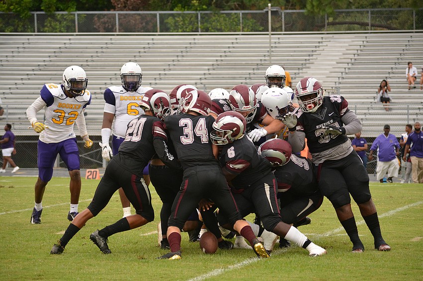 A Riverview gang tackle forces a Booker fumble.