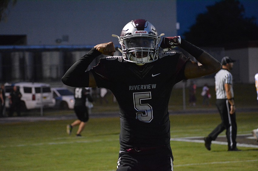 Arthur Brantley flexes after throwing a touchdown pass.