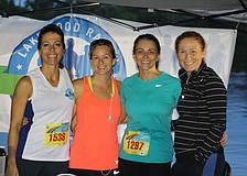 Lakewood Ranch's Andrea Reutsky, Jessica Sandoval, Sharon Smyth and Crea Kitcher represent the Lakewood Ranch Running Club at the 5K race.