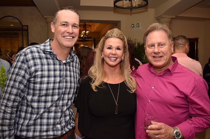 Jared Hermann with Traci and Michael Smullen