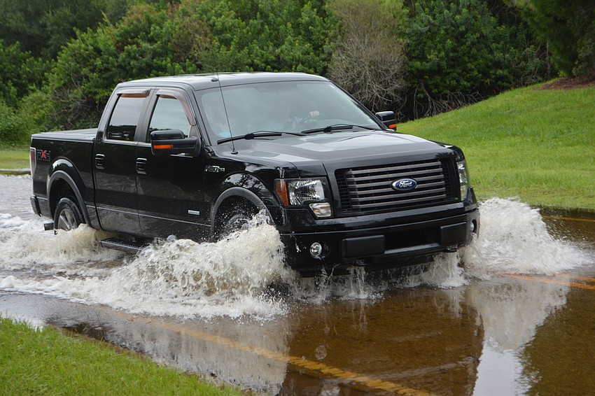 Some vehicles were better equipped to handle the water, such as this truck on Hidden River Trail. Photo by Jay Heater