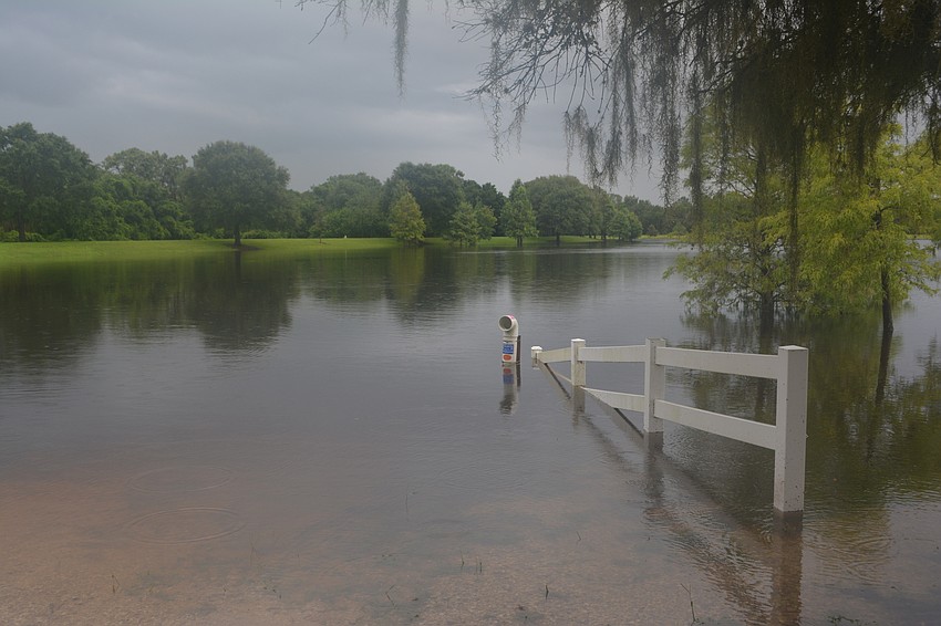 Trophy Lake in Lakewood Ranch was about maxed out handling more than 7 inches of rain on Saturday night. Photo by Jay Heater