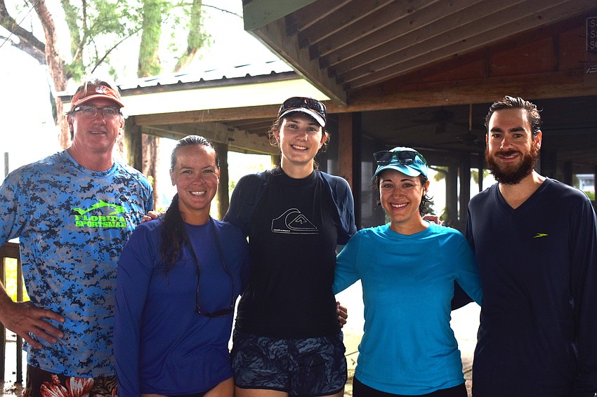 Jeff Jamison, Jennifer Lampl, Lauren Kabat, Darcy Young and Stephen Kuehl were supposed to kayak around Sarasota Bay during the search but decided to hold off because of the weather.