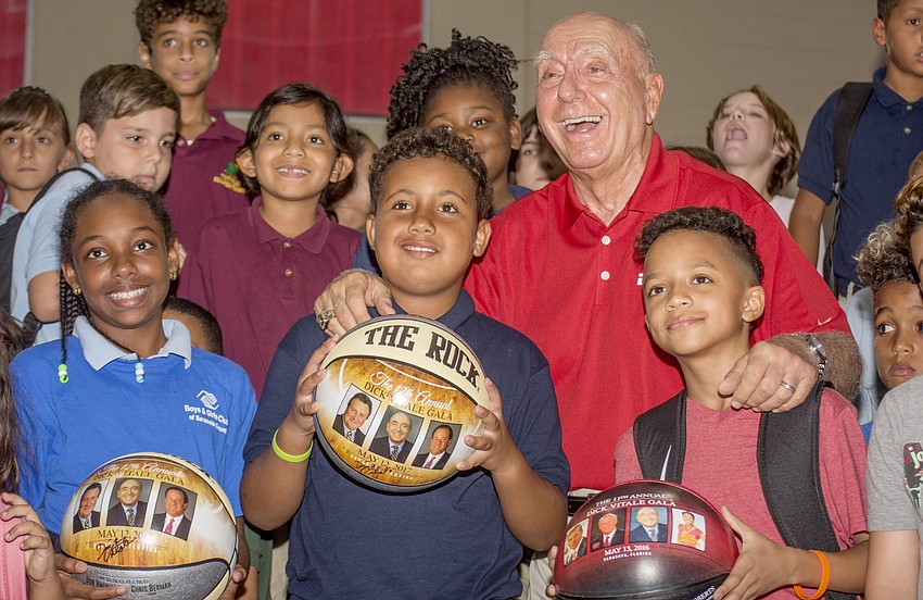 Dick Vitale poses with club members.