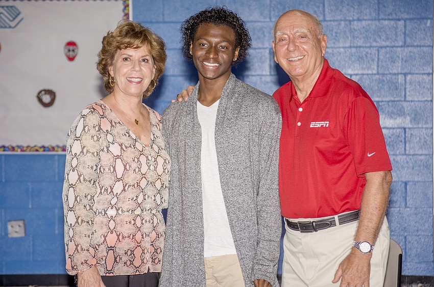 Lorraine Vitale, scholarship recipient Hassan Hogan and Dick Vitale