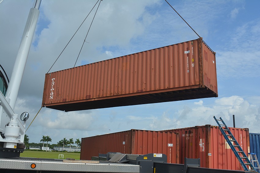 A shipping crate full of shells arrives at Nathan Benderson Park.
