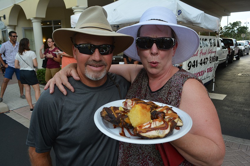 Heritage Harbour's Terry and Pauline Mygrants enjoy some barbecue along Lakewood Main.