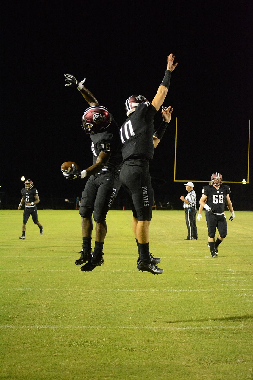 Knowledge McDaniel and Bryan Gagg celebrate after Gagg hit McDaniel with a touchdown pass.