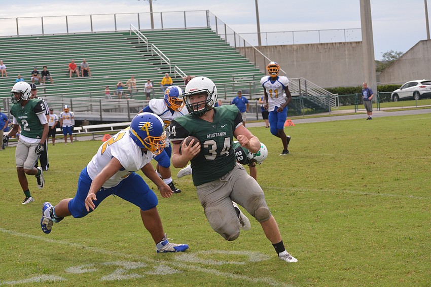 Chase Sharp takes an outside handoff up the field.