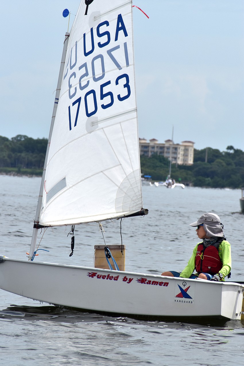 Despite the races being postponed, sailors headed out on the water to wait for the wind to pick up.