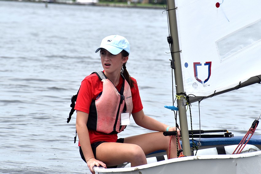 Despite the races being postponed, sailors headed out on the water to wait for the wind to pick up.