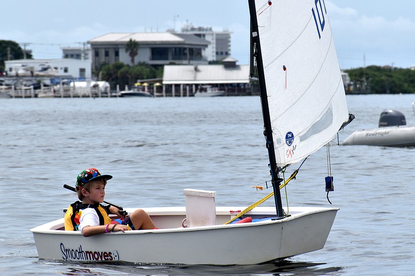 Despite the races being postponed, sailors headed out on the water to wait for the wind to pick up.