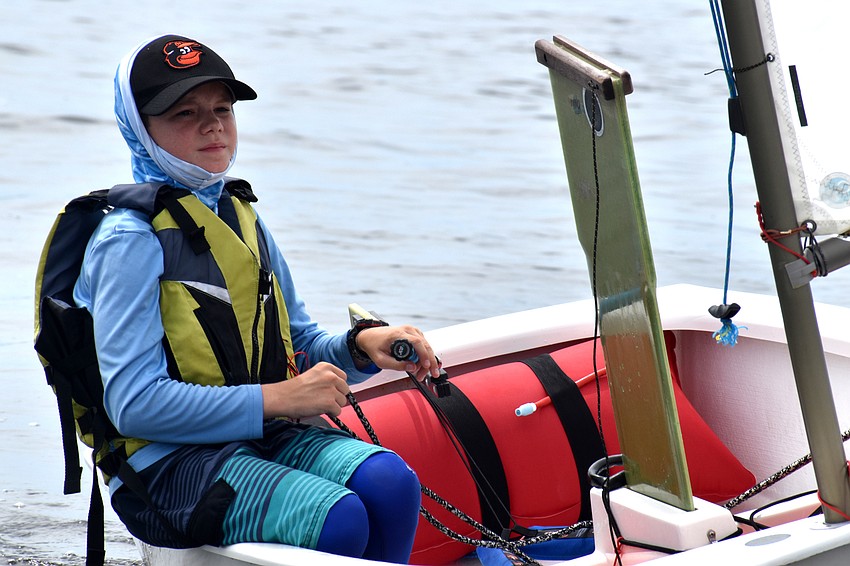 Despite the races being postponed, sailors headed out on the water to wait for the wind to pick up.