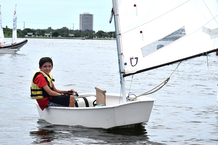 Despite the races being postponed, sailors headed out on the water to wait for the wind to pick up.