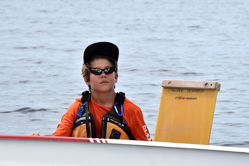 Despite the races being postponed, sailors headed out on the water to wait for the wind to pick up.