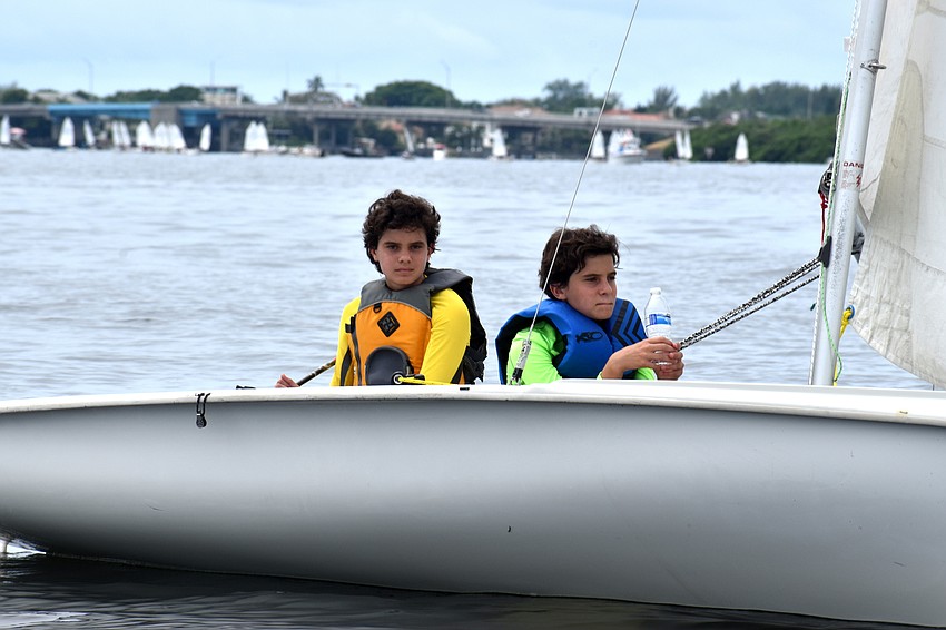Sailors worked their way out on the water while waiting for the wind to pick up.