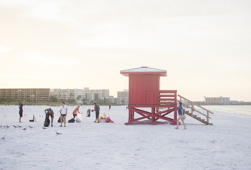 Volunteers pick up trash Sept. 5 on Siesta Key Public Beach.