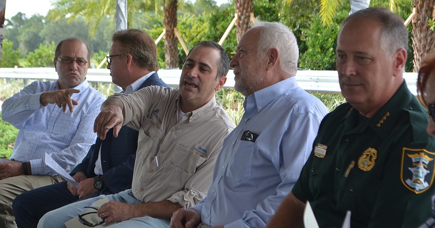 Sarasota County Administrator Tom Harmer,  Sarasota County Commissioners Mike Moran and Paul Caragiulo, SMR CEO Rex Jensen and Sarasota County Sheriff Tom Knight get ready to address the public.